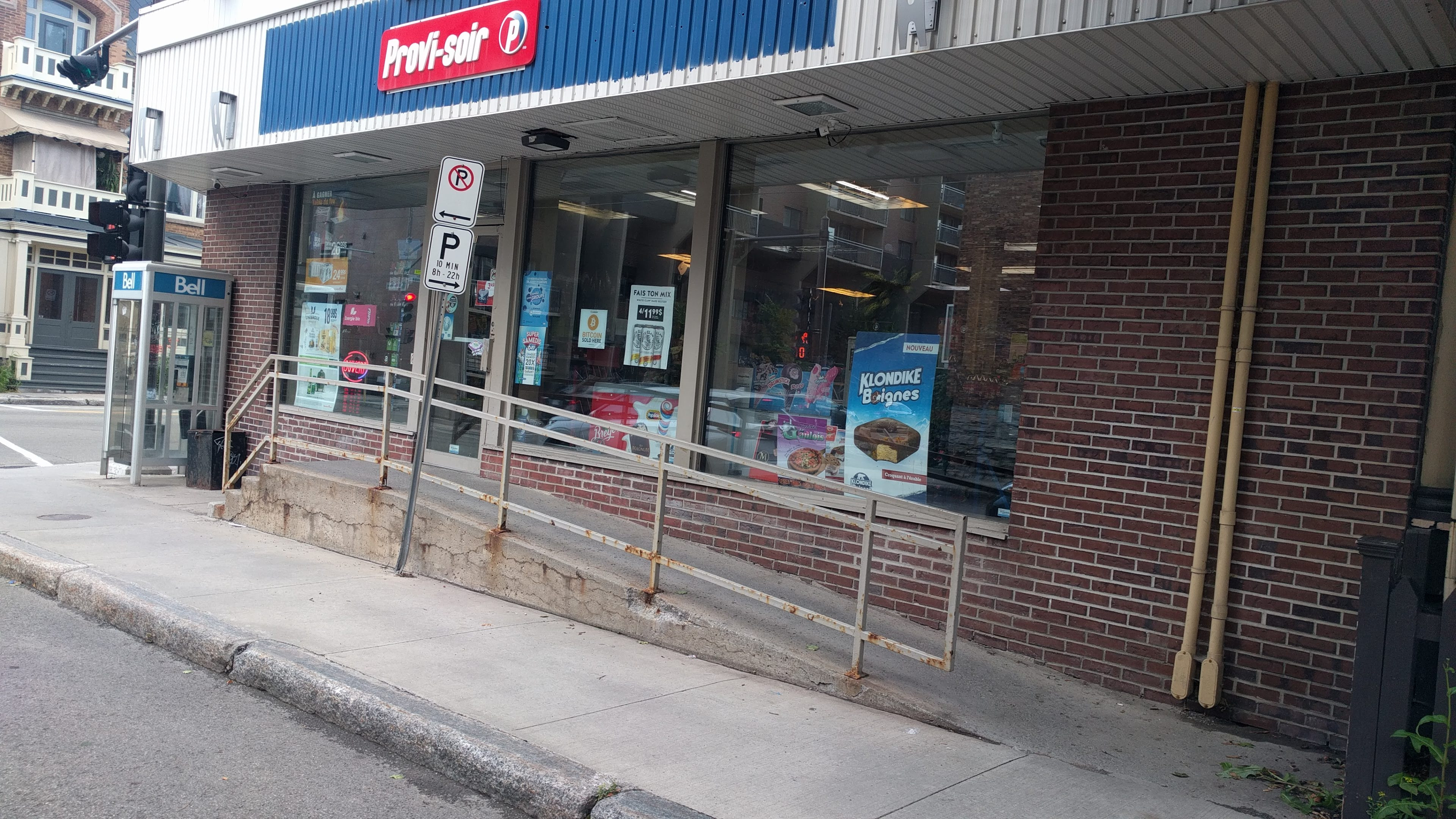 Tough choice - how to choose between Bell's public telephone and this major Quebec convenience store chain's crhypeto offer right next to it?